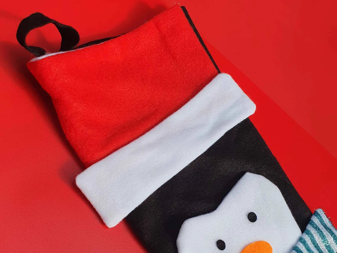 close up of personalised area on penguin christmas stocking