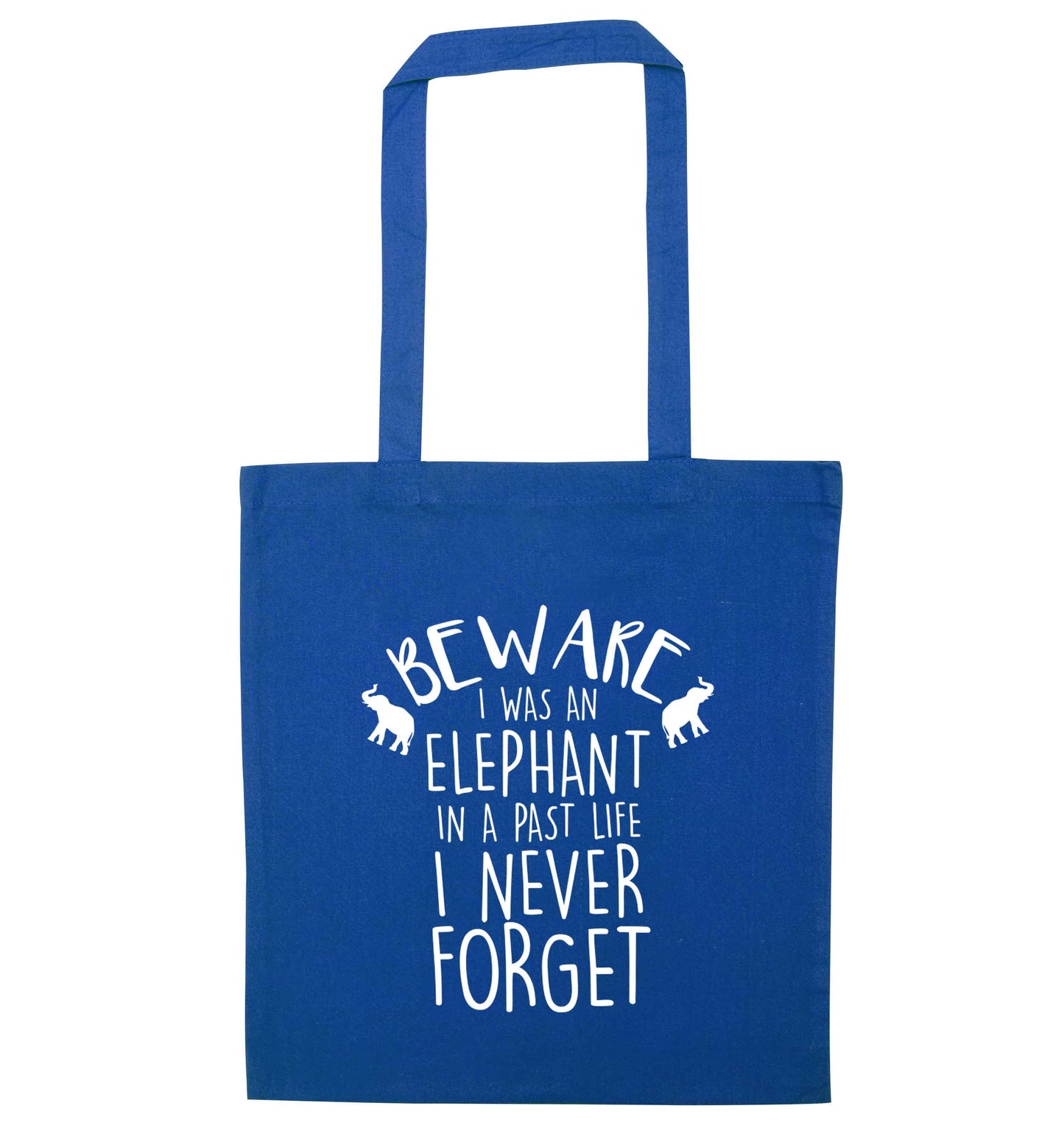 Beware I was an elephant in my past life I never forget blue tote bag