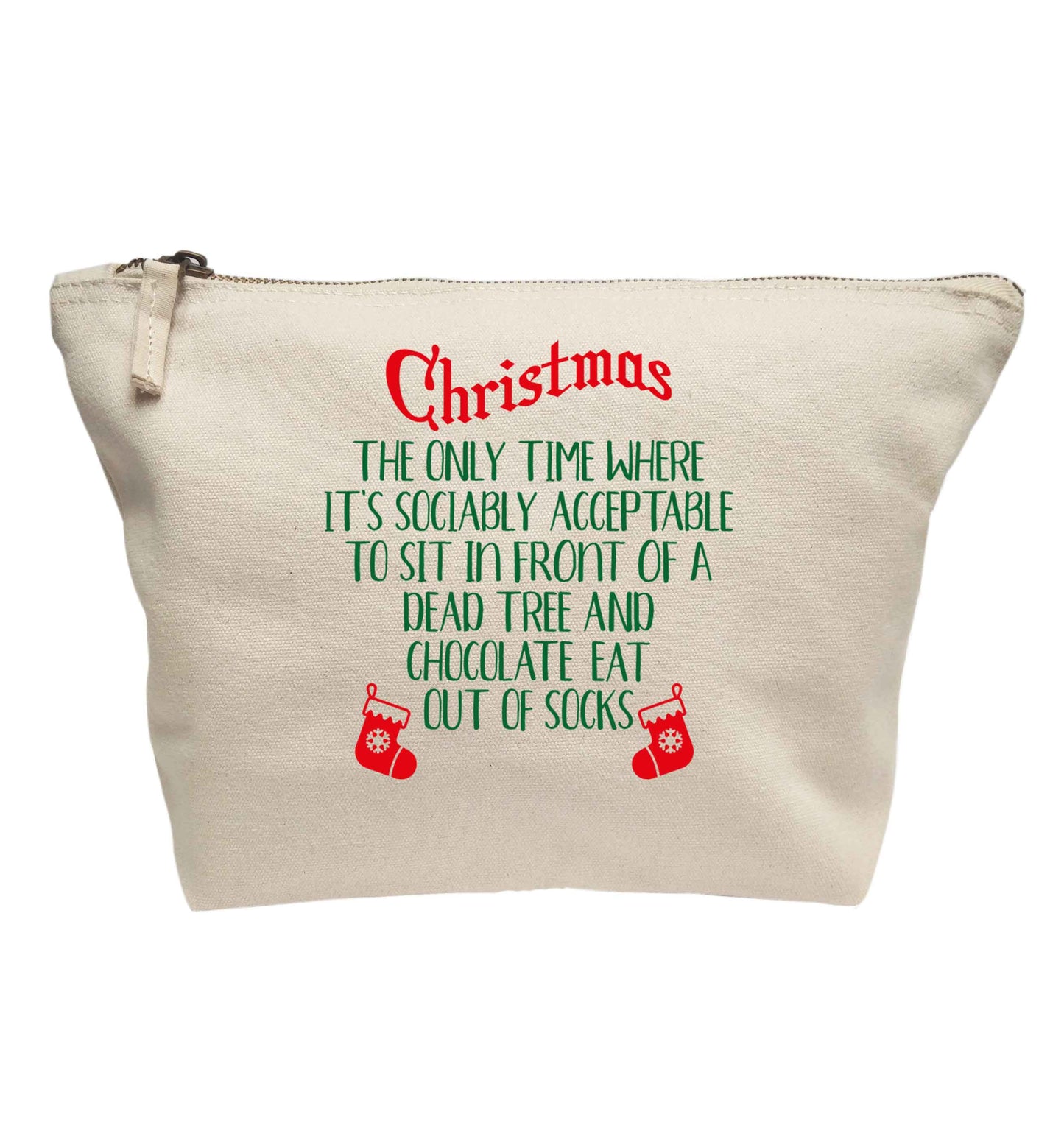 Christmas sit in front of a dead tree and eat chocolate out of socks | makeup / wash bag