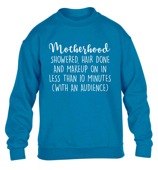 Motherhood, showered, hair done and makeup on children's blue sweater 12-13 Years