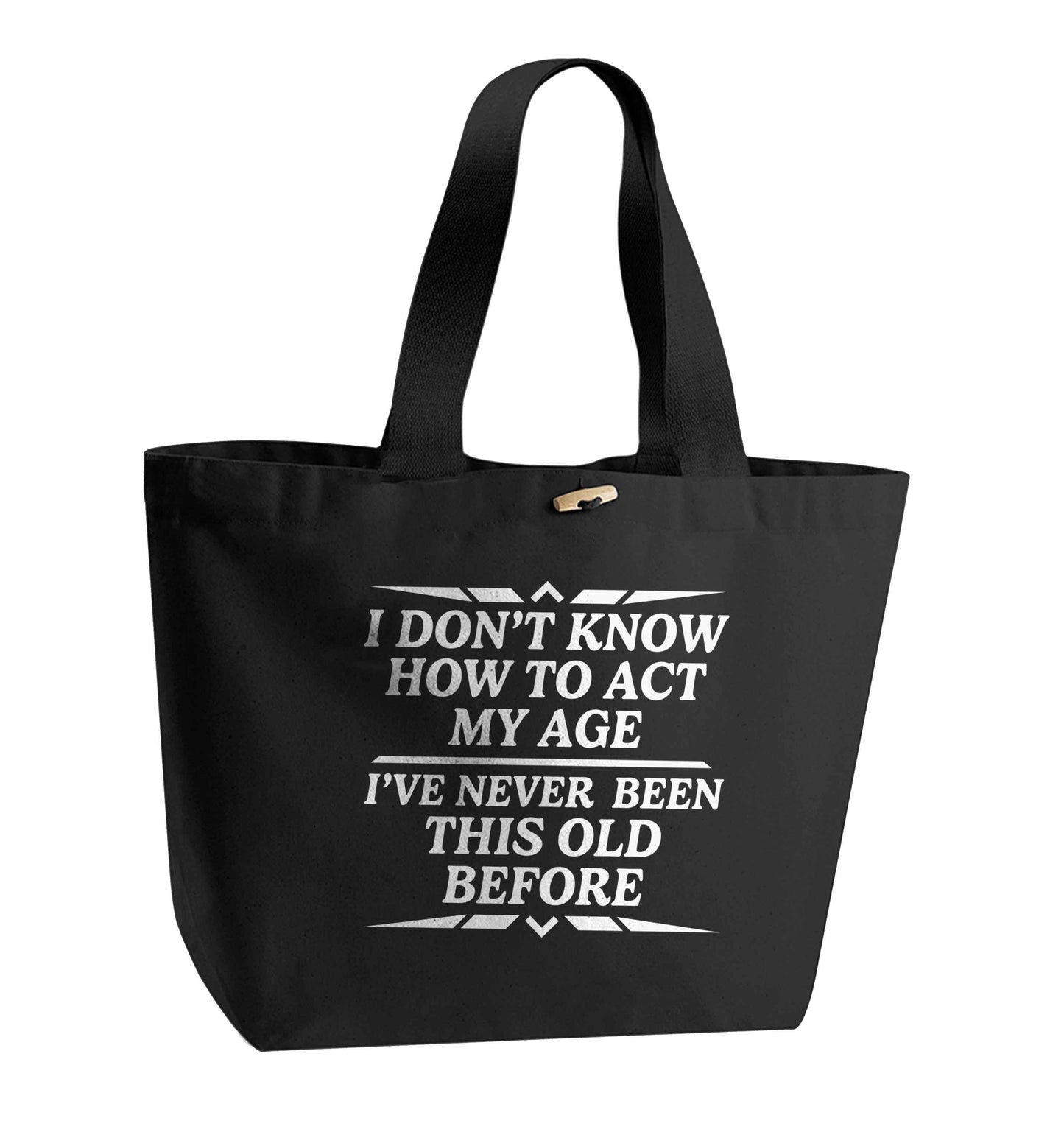 I don't know how to act my age I've never been this old before organic cotton premium tote bag with wooden toggle in black