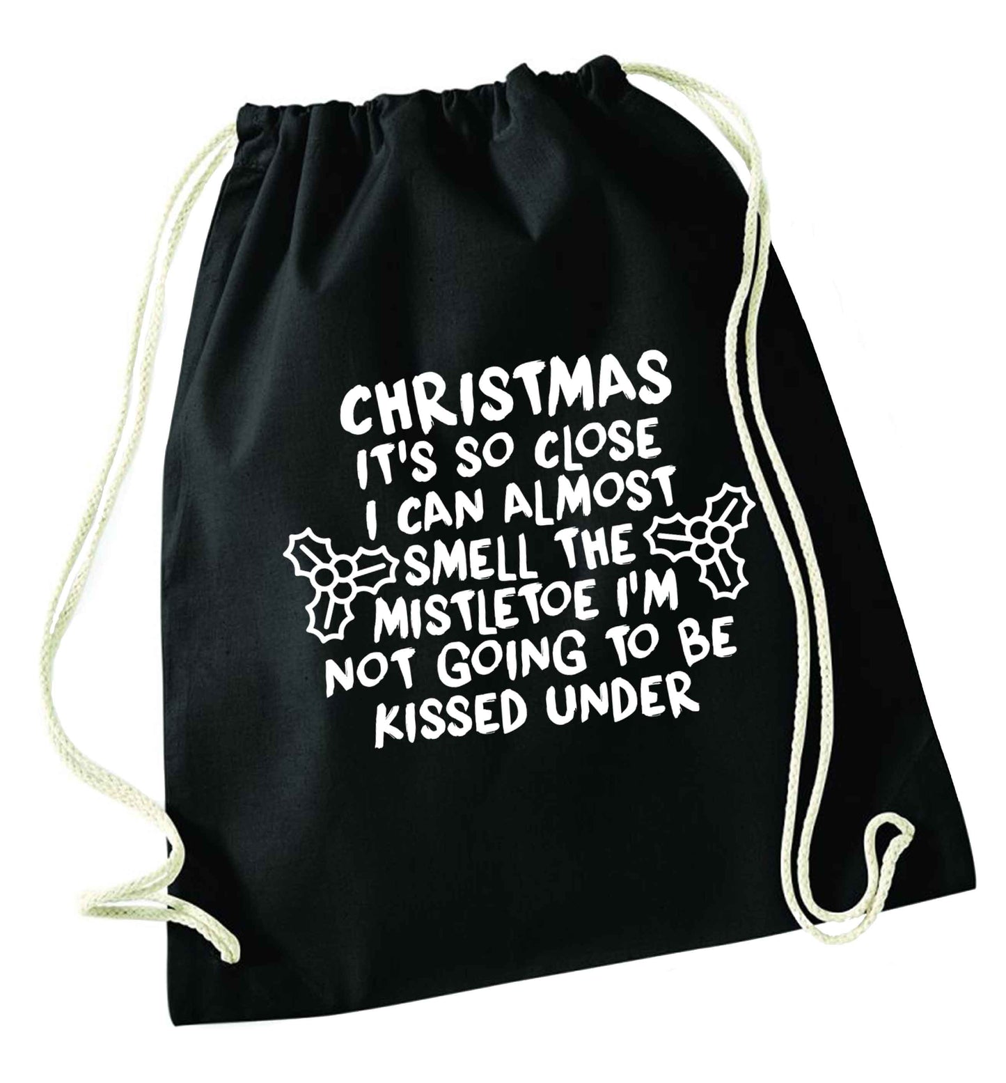 Christmas it's so close I can almost smell the misteltoe I'm not going to be kissed under black drawstring bag