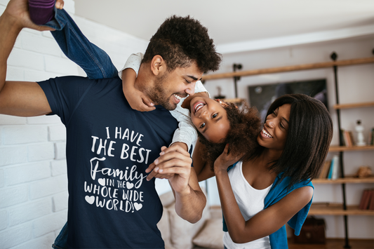family having fun, dad is wearing a navy T-Shirt that says I have the best family in the whole wide world