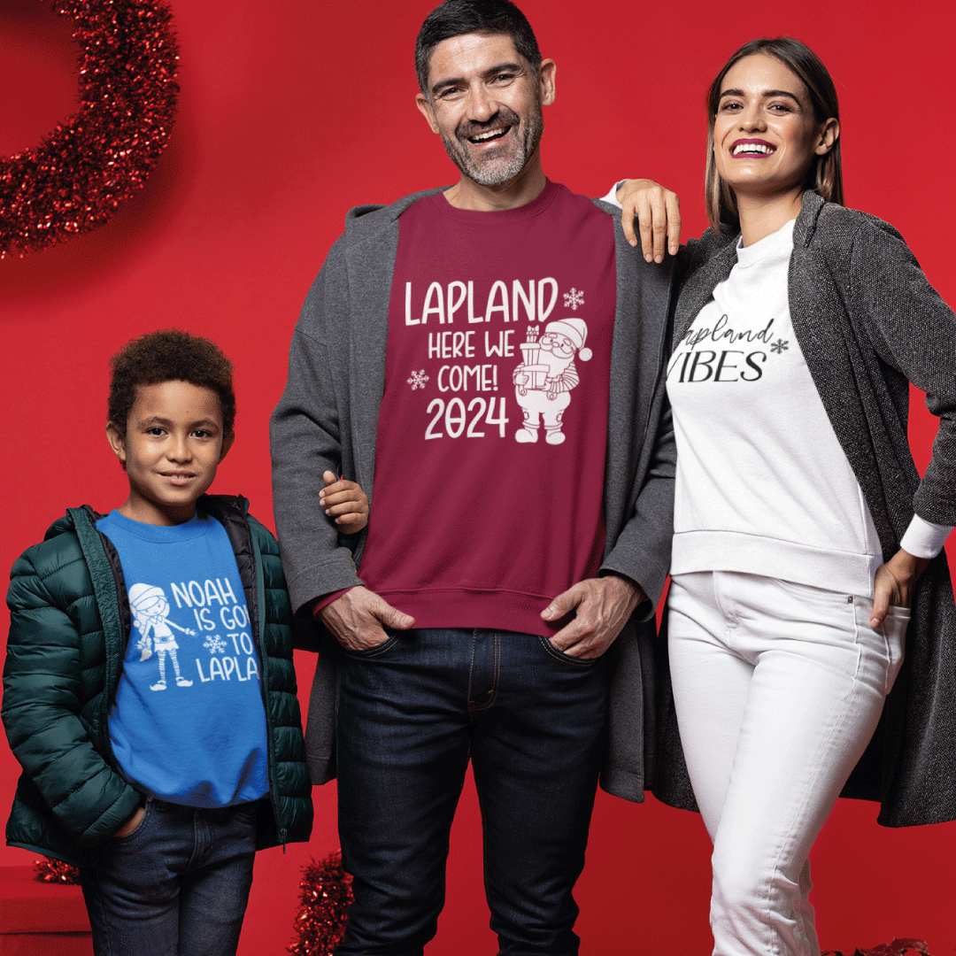 A son, mum and dad all wearing Christmas Lapland Jumpers
