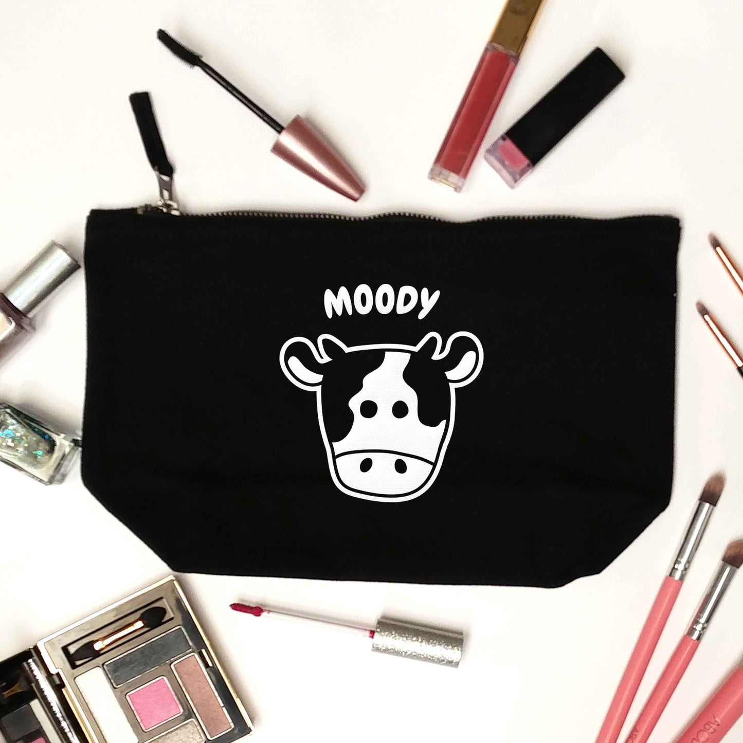 Moody cow illustration black makeup bag