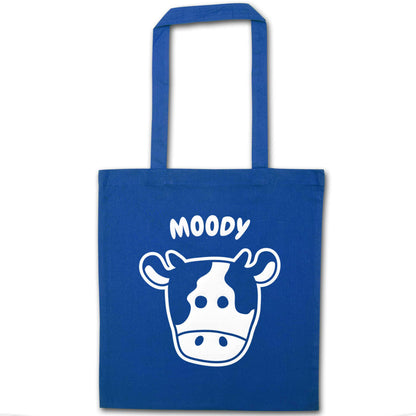 Moody cow illustration blue tote bag