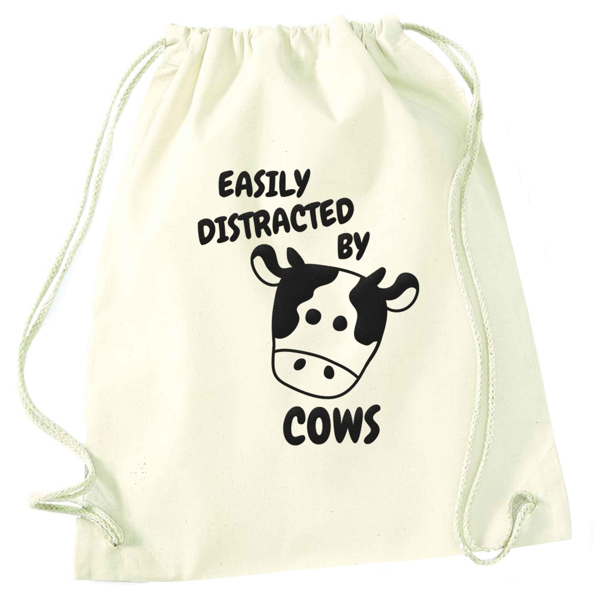 Easily distracted by cows natural drawstring bag