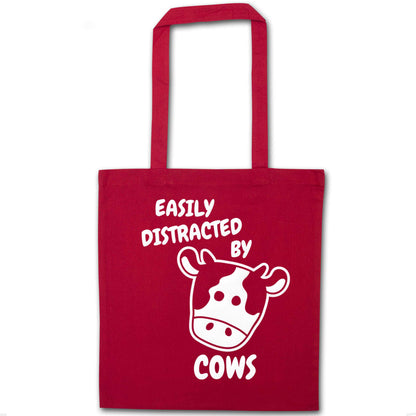 Easily distracted by cows red tote bag