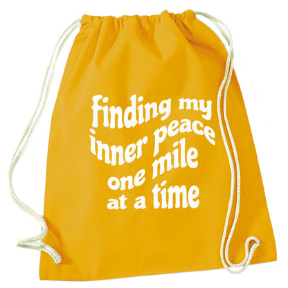 Finding my inner peace one mile at a time mustard drawstring bag