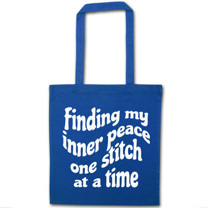 Finding My Inner Peace One Stitch at a Time blue tote bag