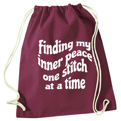 Finding My Inner Peace One Stitch at a Time maroon drawstring bag