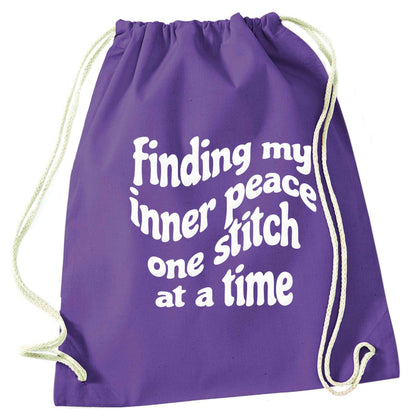 Finding My Inner Peace One Stitch at a Time purple drawstring bag