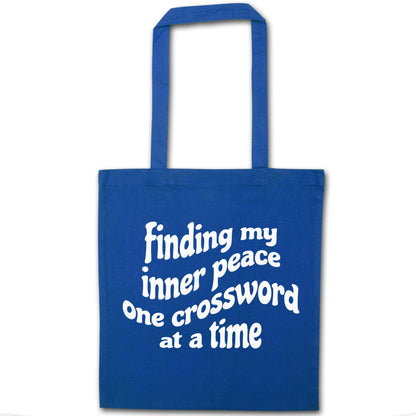 Finding My Inner Peace One Crossword at a Time blue tote bag