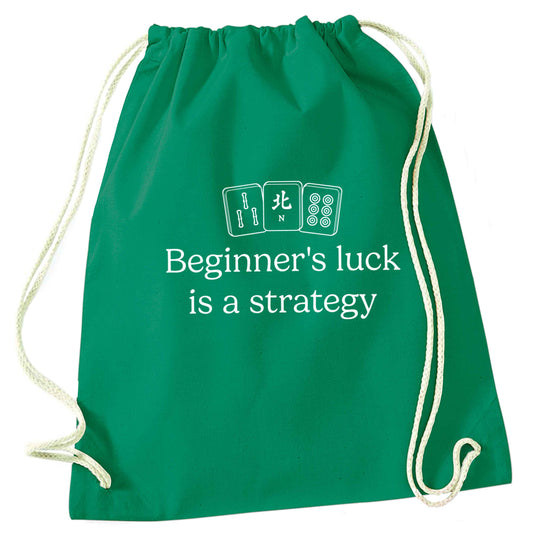 Beginner's Luck Is a Strategy green drawstring bag