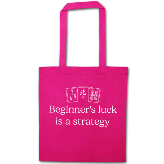 Beginner's Luck Is a Strategy pink tote bag