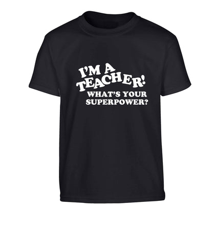 I'm a teacher what's your superpower?! Children's black Tshirt 12-13 Years