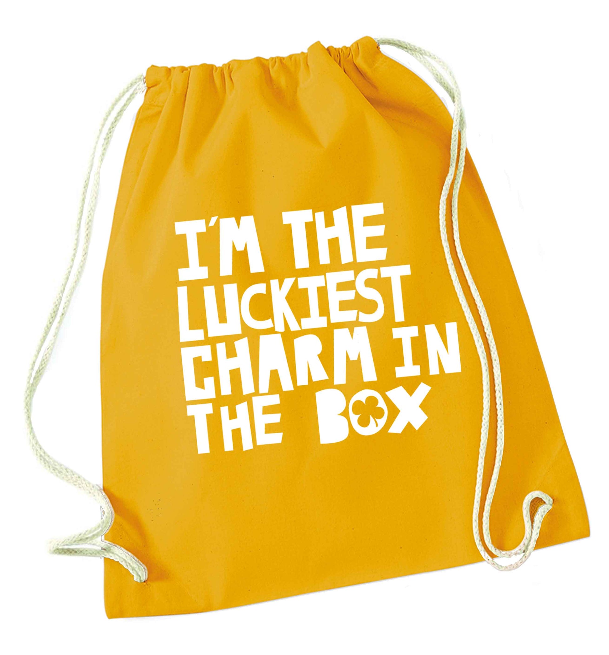I'm the luckiest charm in the box mustard drawstring bag