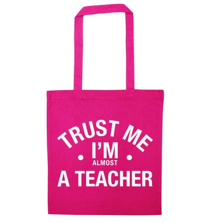Trust me I'm almost a teacher pink tote bag