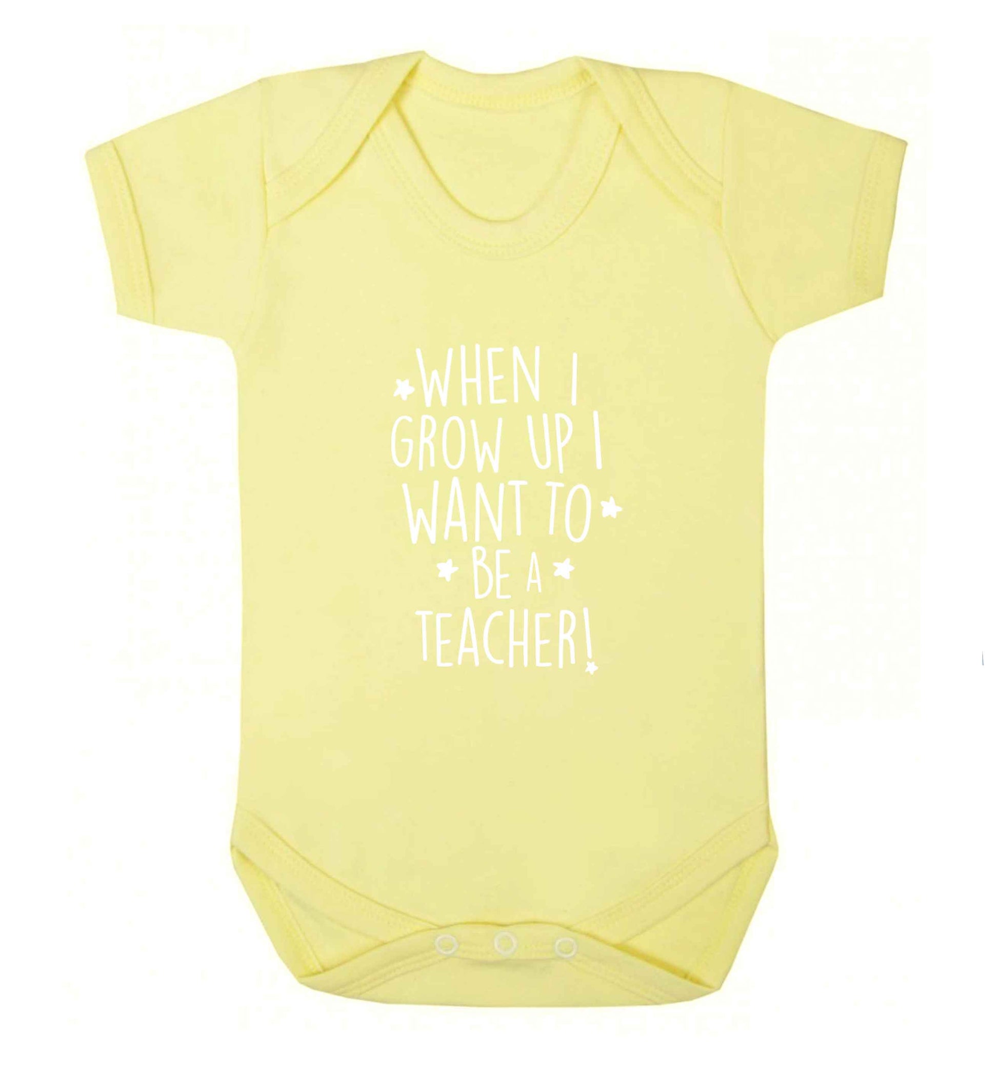 When I grow up I want to be a teacher baby vest pale yellow 18-24 months