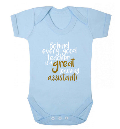 Behind every good teacher is a great teaching assistant baby vest pale blue 18-24 months