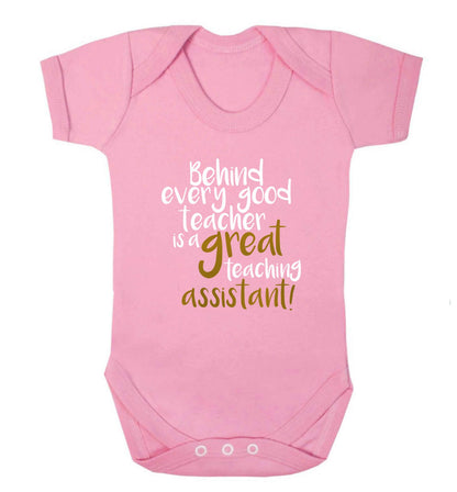Behind every good teacher is a great teaching assistant baby vest pale pink 18-24 months