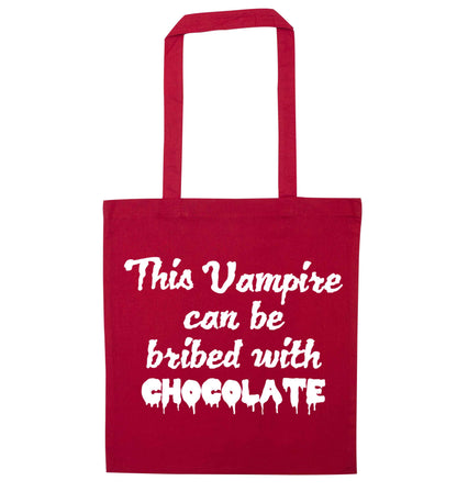 This vampire can be bribed with chocolate red tote bag