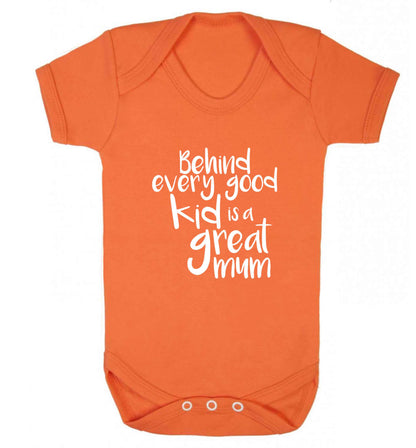 Behind every good kid is a great mum baby vest orange 18-24 months