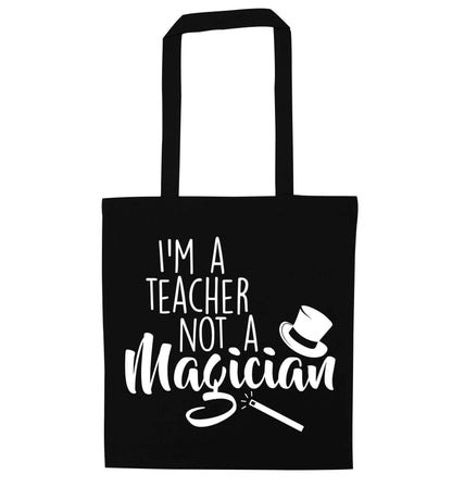 I'm a teacher not a magician black tote bag