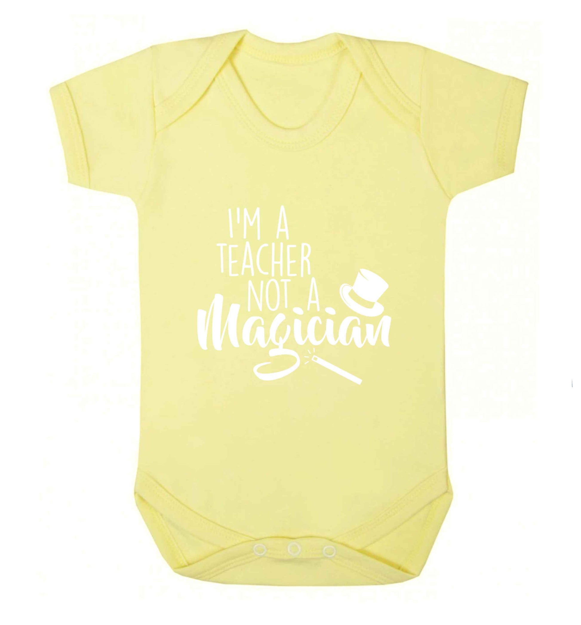 I'm a teacher not a magician baby vest pale yellow 18-24 months