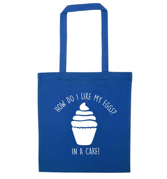 How do I like my eggs? In a cake! blue tote bag