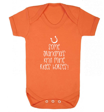 Some grandma's knit mine rides horses baby vest orange 18-24 months