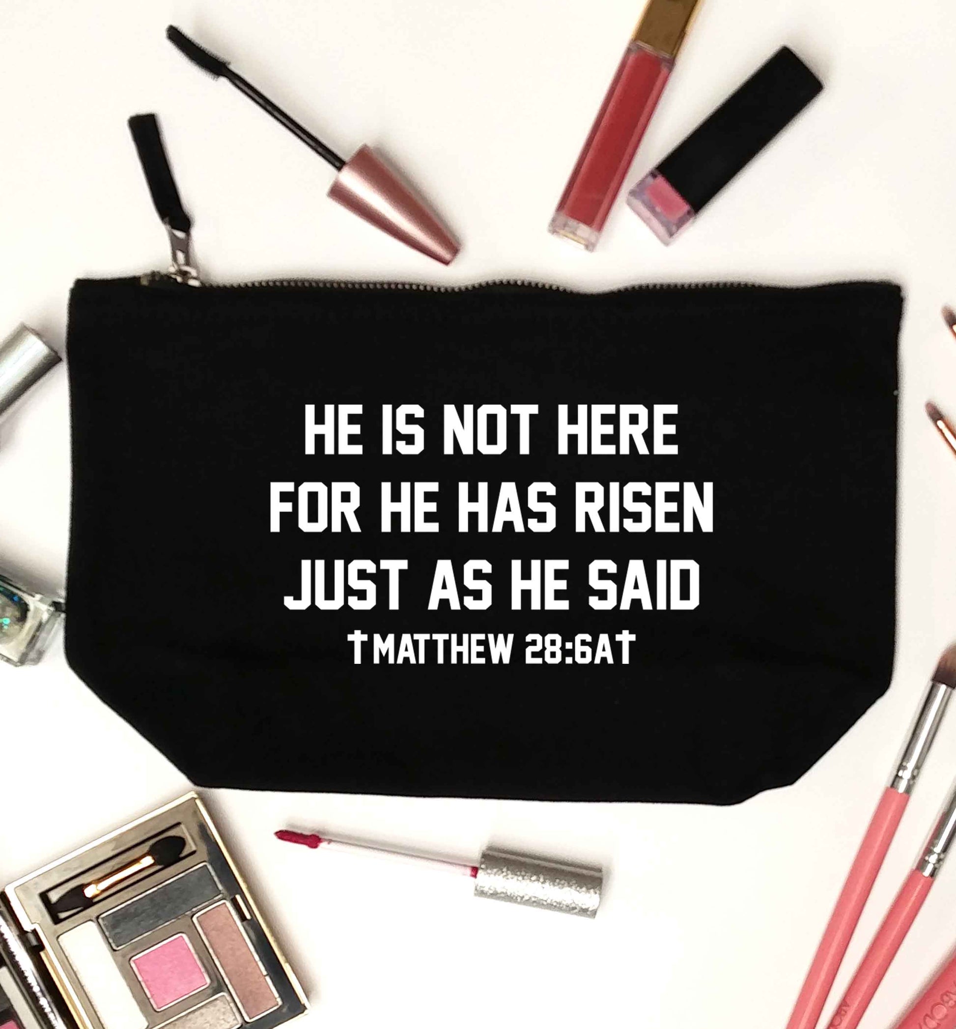 He is not here for he has risen just as he said matthew 28:6A black makeup bag
