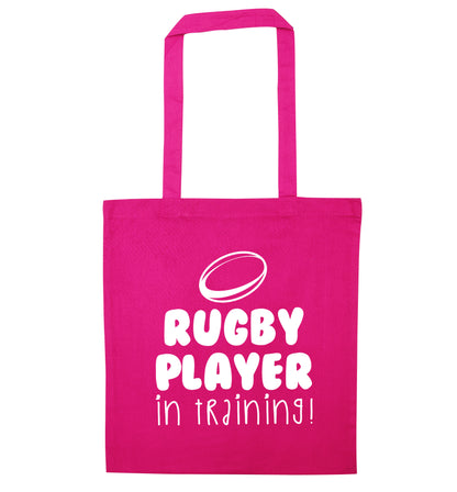 Rugby player in training pink tote bag