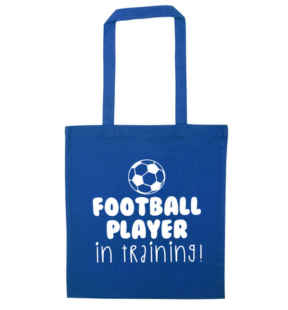Football player in training blue tote bag