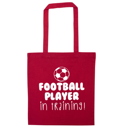 Football player in training red tote bag