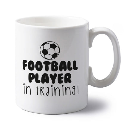 Football player in training left handed white ceramic mug 
