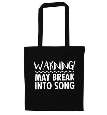 Warning may break into song black tote bag