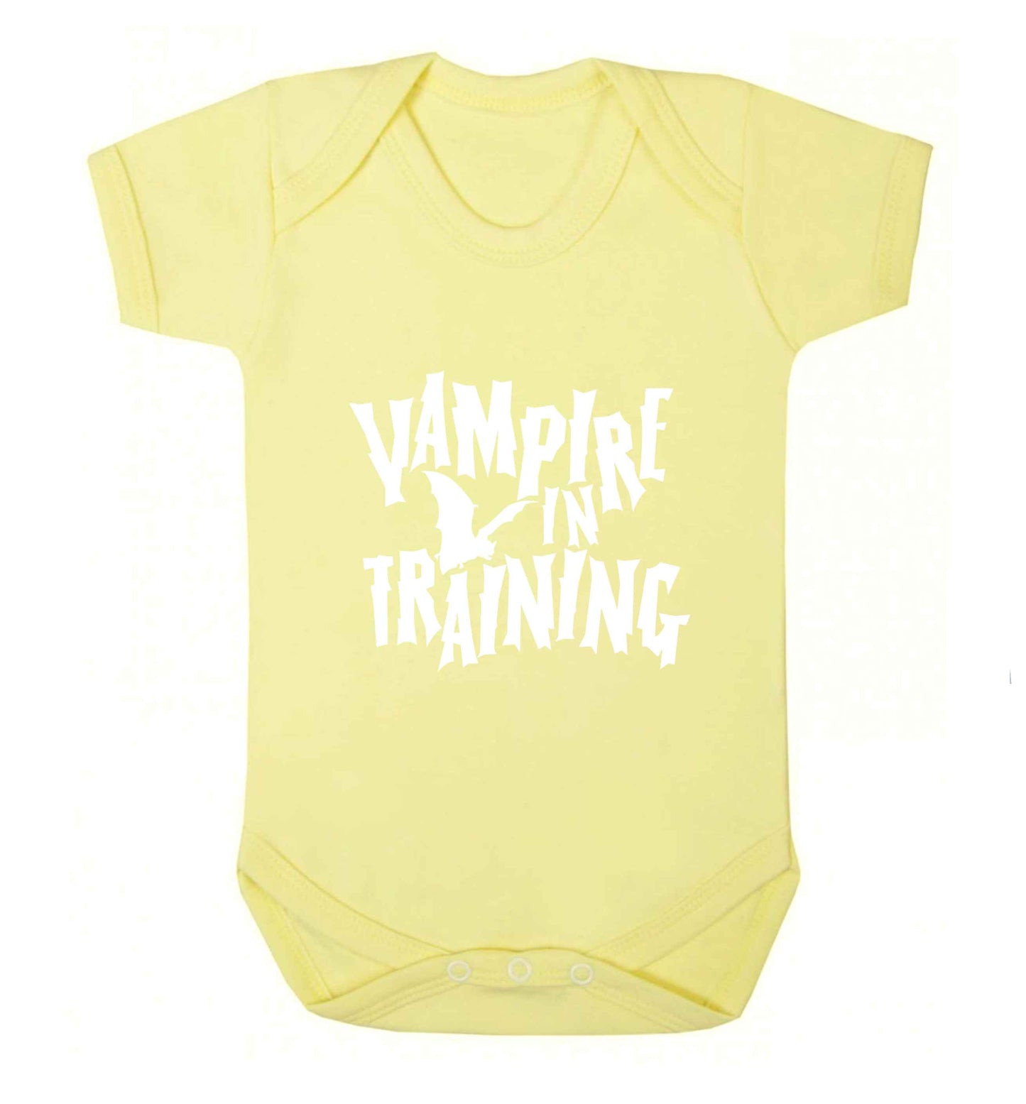 Vampire in training baby vest pale yellow 18-24 months