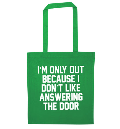 I'm only out because I don't like answering the door green tote bag