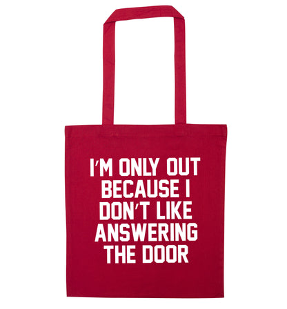 I'm only out because I don't like answering the door red tote bag