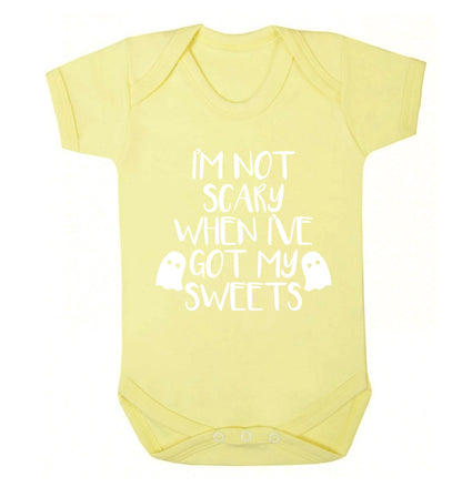 I'm not scary when I've got my sweets Baby Vest pale yellow 18-24 months