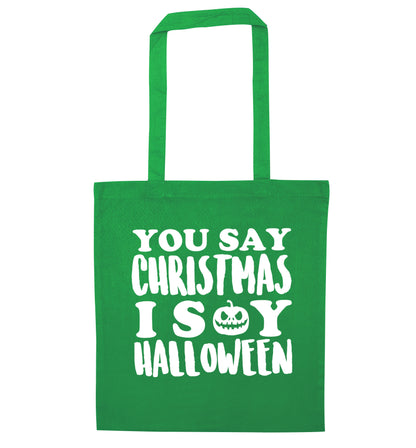 You say christmas I say halloween! green tote bag