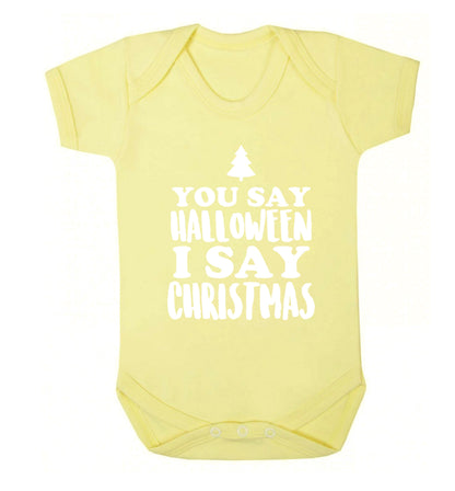 You say halloween I say christmas! Baby Vest pale yellow 18-24 months