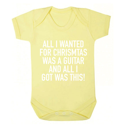 All I wanted for Christmas was a guitar and all I got was this! Baby Vest pale yellow 18-24 months