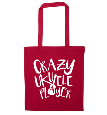 Crazy ukulele player red tote bag
