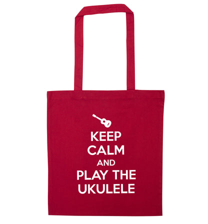 Keep calm and play the ukulele red tote bag