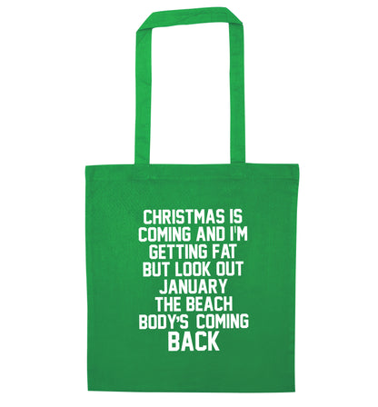 Christmas is coming and I'm getting fat but look out January the beach body's coming back! green tote bag