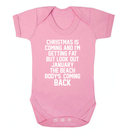 Christmas is coming and I'm getting fat but look out January the beach body's coming back! Baby Vest pale pink 18-24 months