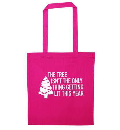 The tree isn't the only thing getting lit this year pink tote bag