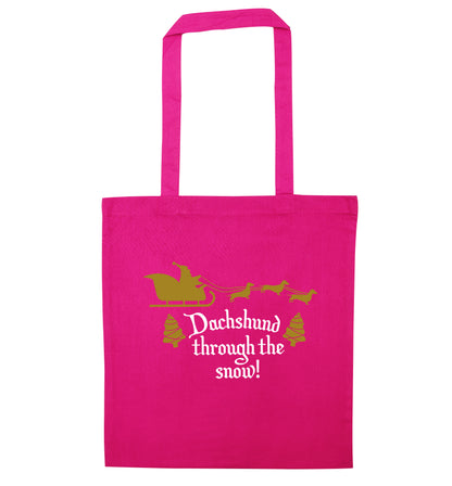 Dachshund through the snow pink tote bag